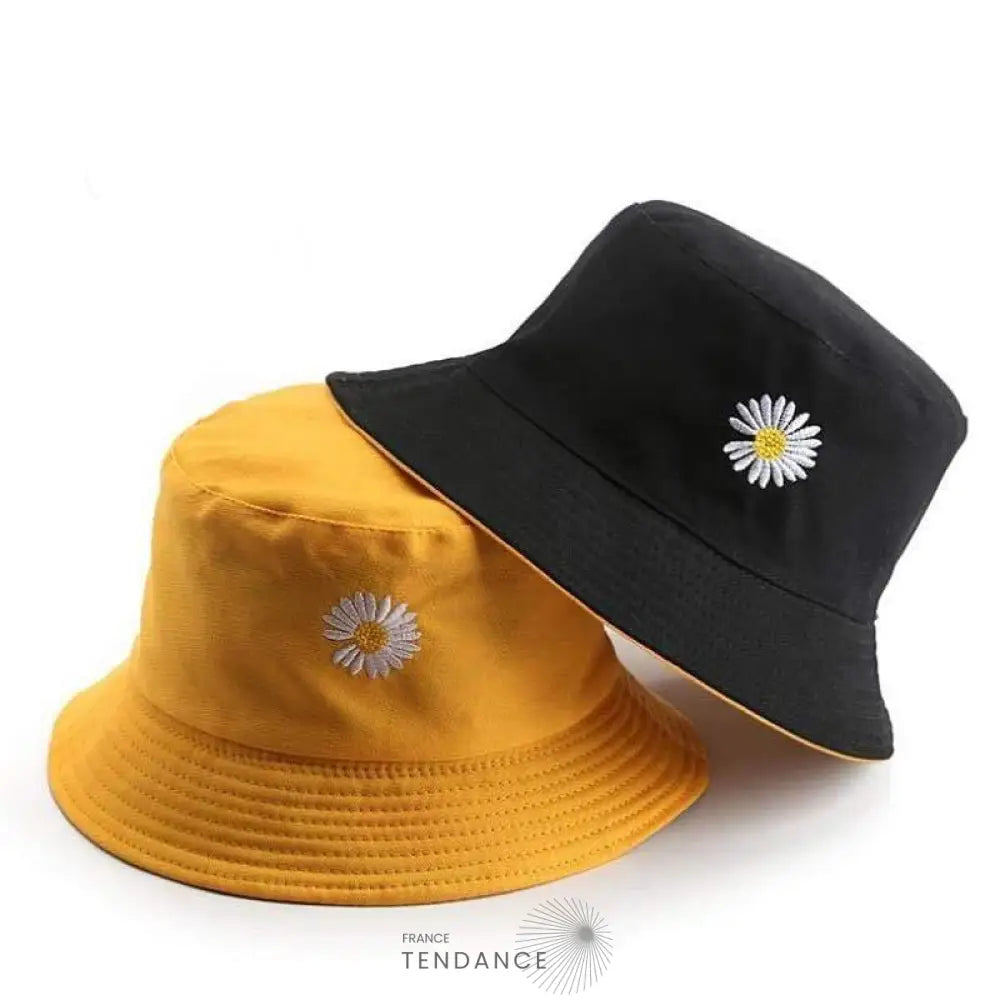 Bob réversible Flower en coton, présenté en noir et jaune avec un motif marguerite blanche